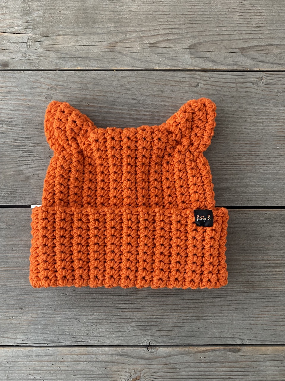 Czapka-z-uszami-welna-merino-pomaranczowa